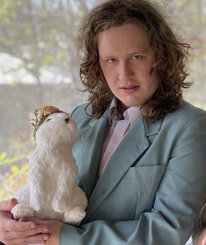 Image of Mr. Pareizs, holding a prop rabbit. Image of Mr. Pareizs, holding a prop rabbit.